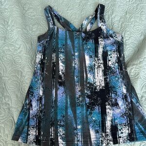 Yoga top with attached padded bra and hidden back zip pocket